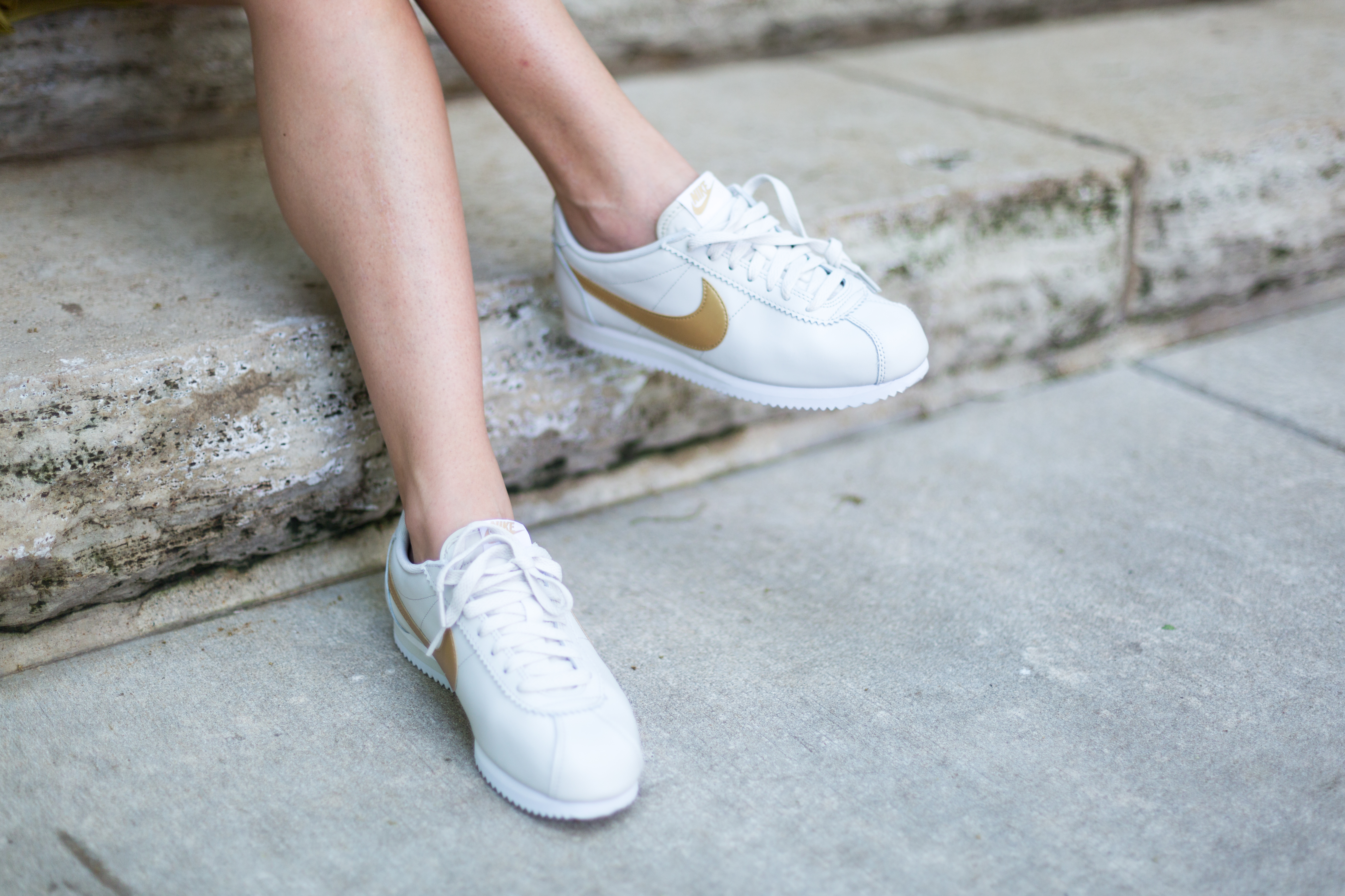 nike cortez womens white and gold