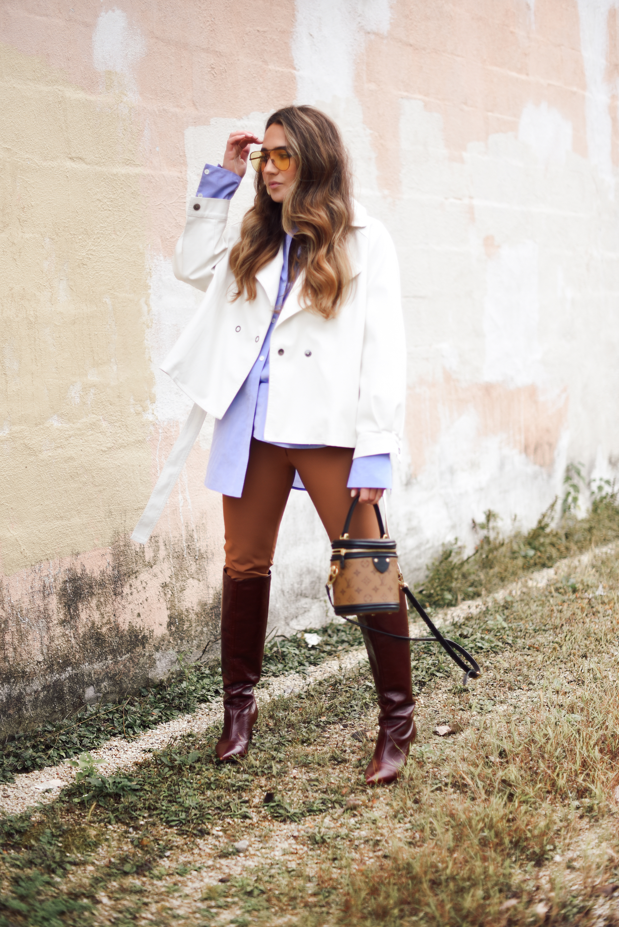 white-leather-jacket-button-up-shirt-blue-knee-high-maroon-boot-bucket-bag-fall-outfit-inspo-street-style-look