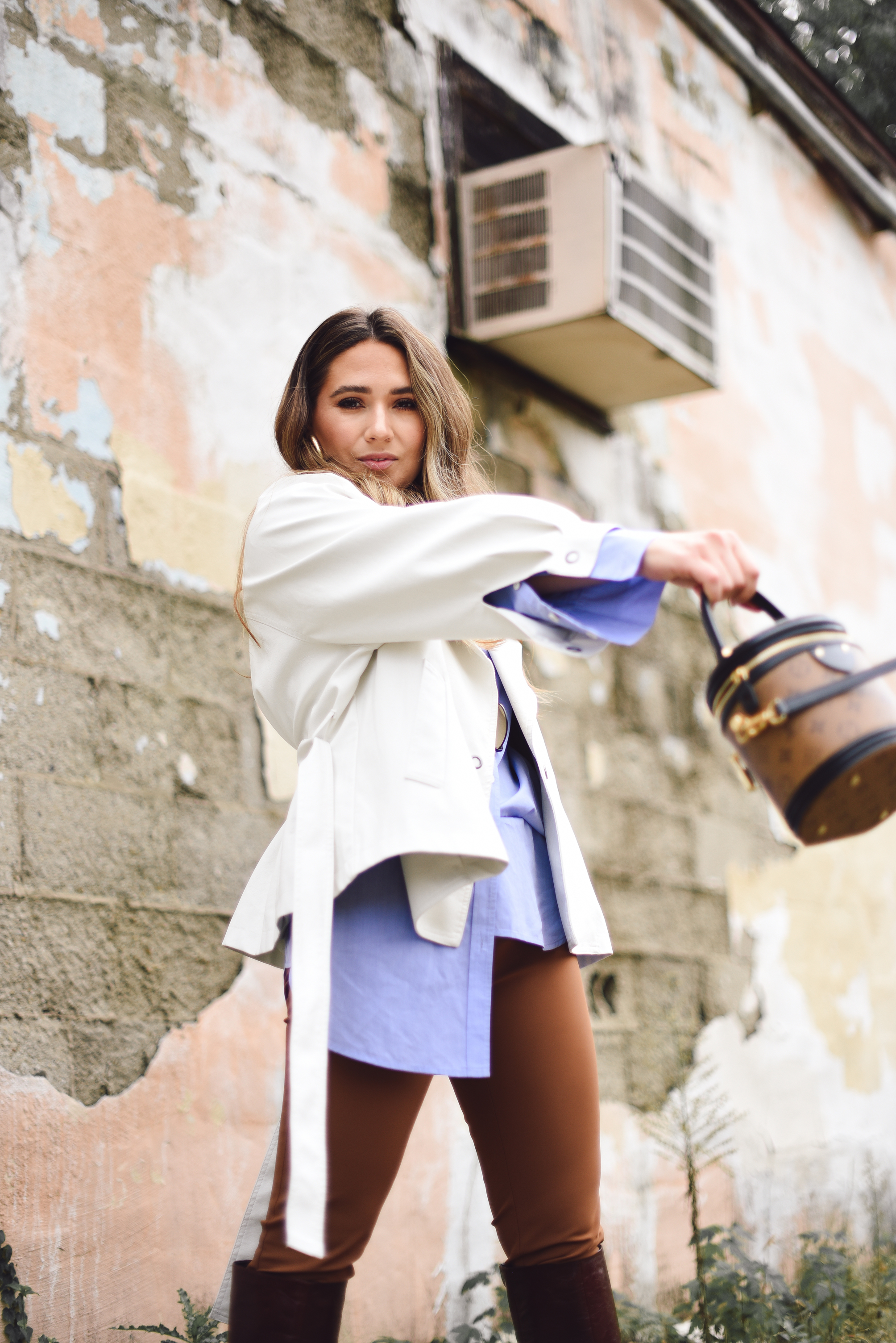 white-leather-jacket-button-up-shirt-blue-knee-high-maroon-boot-bucket-bag-fall-outfit-inspo-street-style-look