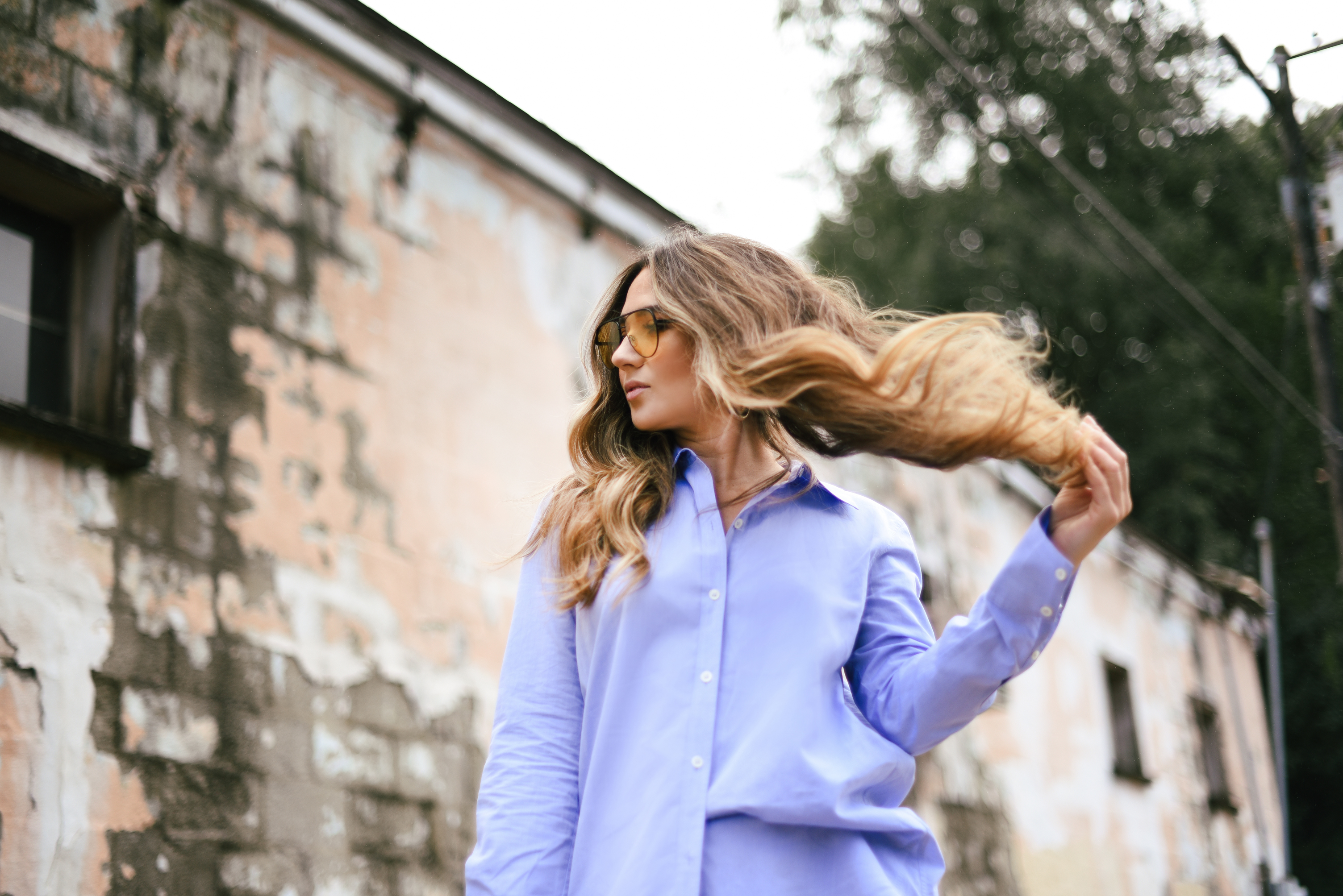 white-leather-jacket-button-up-shirt-blue-knee-high-maroon-boot-bucket-bag-fall-outfit-inspo-street-style-look